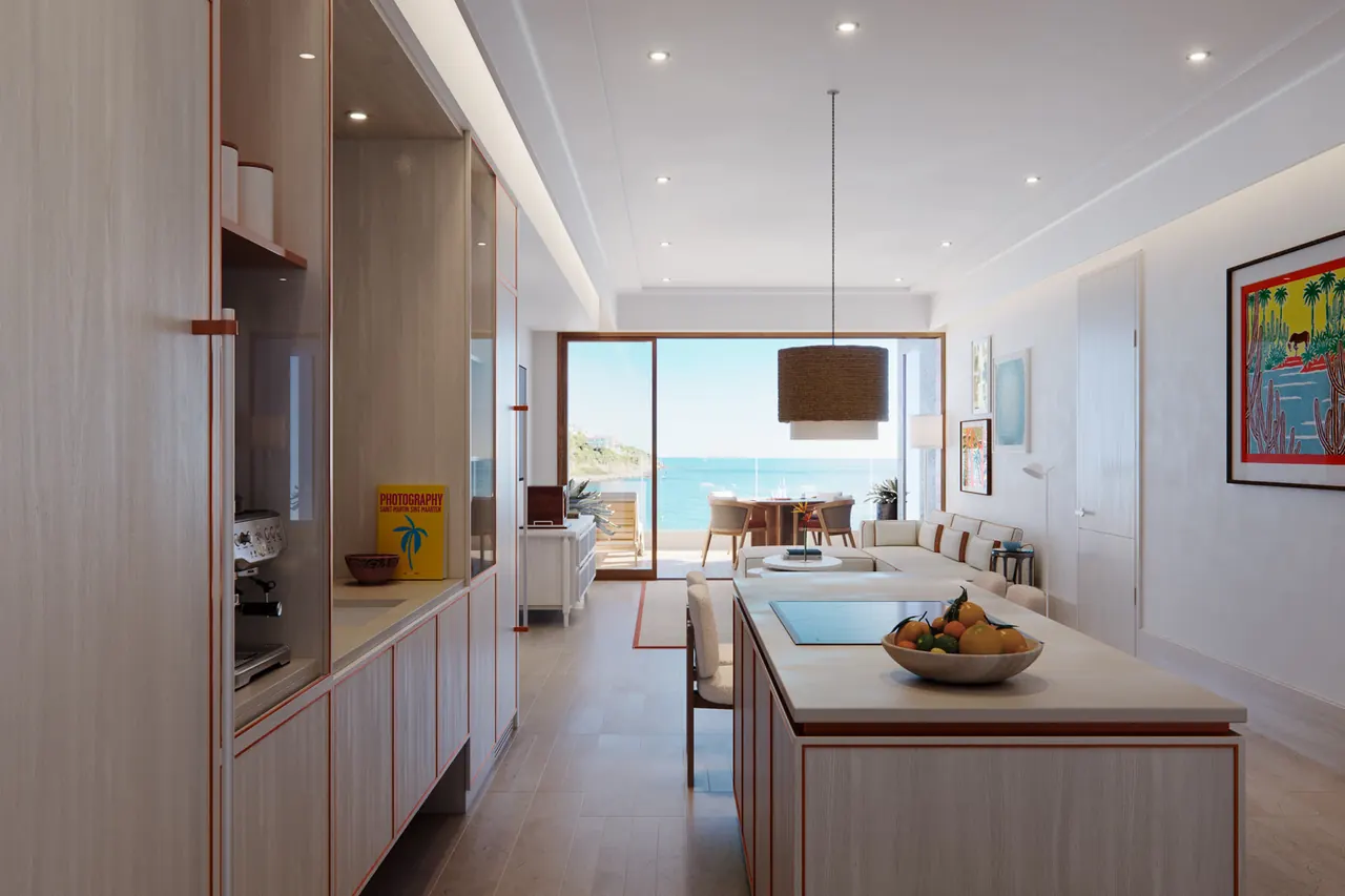 An open living room and galley kitchen with an ocean view, the Orient plan at The Setai, St. Maarten